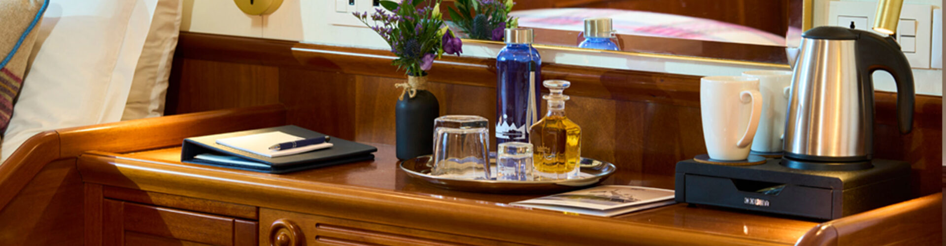 Details of a desk and bed in a cabin on the Lord of the Highlands cruise ship